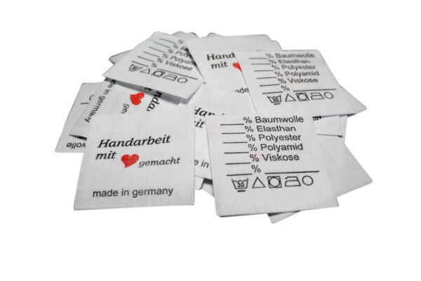 25 Textiletiketten Universal - Handarbeit mit Herz gemacht - 30° - Mischband