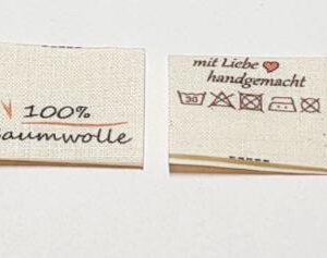 Nachhaltige Textiletiketten auf Naturbaumwolle, Öko-Tex zertifiziertes Band in naturfarben, mittig gefalten