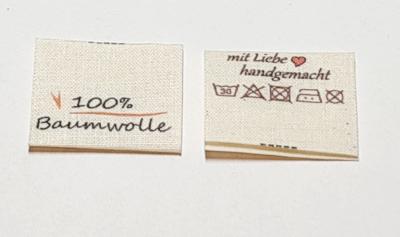 Nachhaltige Textiletiketten auf Naturbaumwolle, Öko-Tex zertifiziertes Band in naturfarben, mittig gefalten