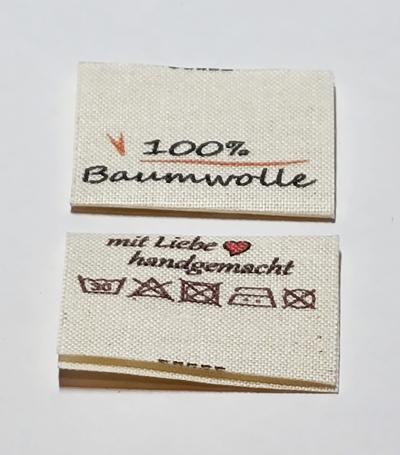 Etiketten auf Naturbaumwolle, Öko-Tex zertifiziertes Band in naturfarben, mittig gefalten