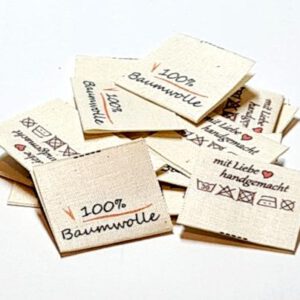 Textile Drucketiketten auf Naturbaumwolle, Öko-Tex zertifiziertes Band in naturfarben, mittig gefalten