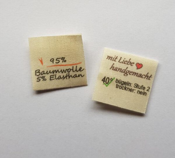 100% Bauwolle, Textiletiketten mittig gefalzt, Lizenzfrei