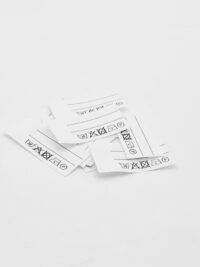 25 St. Textiletiketten mit zwei Linien zum Beschriften und vorgegebenen Pflegesybole