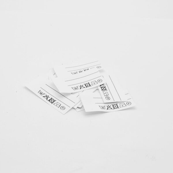 25 St. Textiletiketten mit zwei Linien zum Beschriften und vorgegebenen Pflegesybole