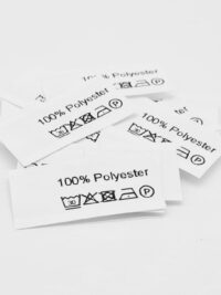 50 Textiletiketten mit der Aufschrift 100% Polyester und Pflegesymbole