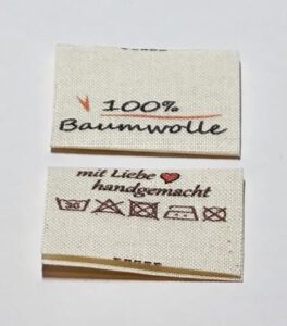 GOTS Label, Etiketten auf Naturbaumwolle, Öko-Tex zertifiziertes Band in naturfarben, mittig gefalten