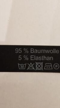 schwarzes Label mit weißem Aufdruck Baumwolle - Elasthan Restposten
